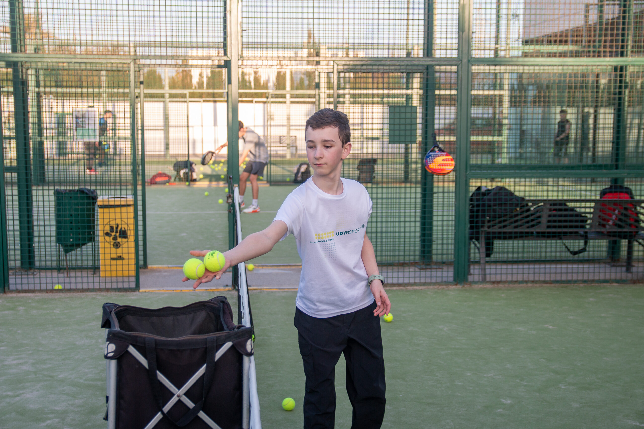 kid playing with balls